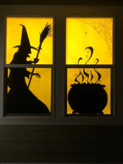 Brewing scary halloween window decorating Witches