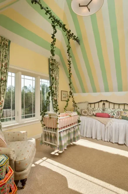 Gender-neutral nursery with white crib, plaid skirt, and floral curtains. Perfect for small nursery