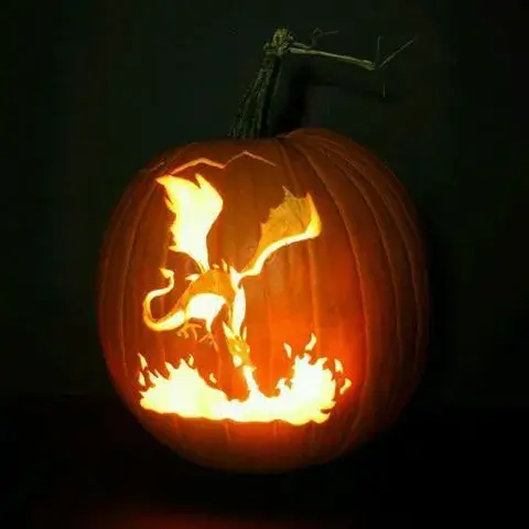 Intricate dragon pumpkin carving with flames, showcasing an awesome and cool design perfect for Halloween contests and easy but impressive decorations.