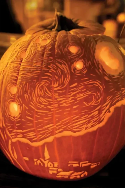 Pumpkin carving inspired by Chewbacca from Star Wars, illuminated from within, showcasing intricate details and perfect for easy but impressive Halloween decorations